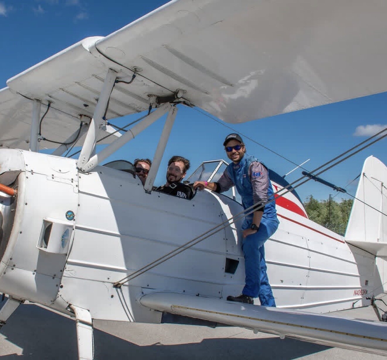 The Tryg Aviation crew with the Grumman G-164A AgCat on the ramp